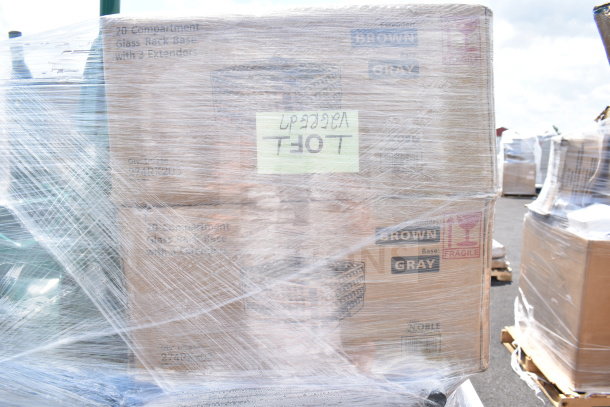 Pallet of 12 new scratch and dent items, including glass caddies, wrapped in plastic. Labels indicate "Fragile" and "20 Compartment Glass Rack Base with Extenders."