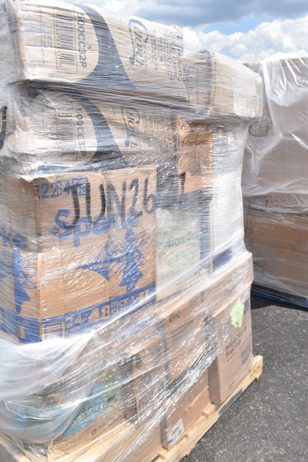 Pallet of 32 brand new scratch and dent items, including bath tissue, trash can liners, wrapped in plastic with markings "JUN26-37".