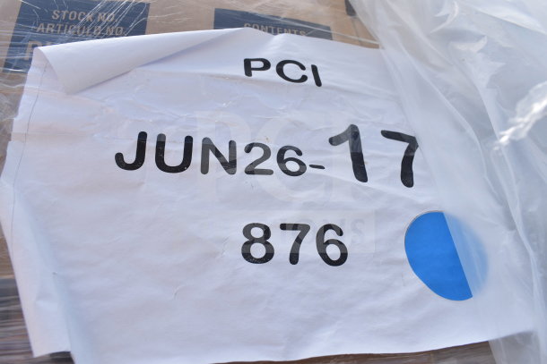 White label showing "PCI JUN26-17 876" with a blue dot, indicating a lot of new scratch and dent items, including Boomerang chairs.