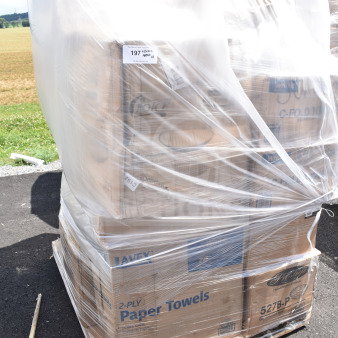 Pallet with 18 new scratch and dent items, including boxed paper towels. Wrapped in plastic. Auction tag "197" visible.