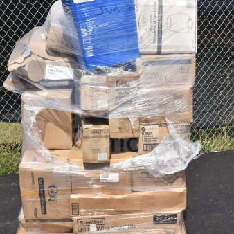 Stack of 36 boxed items including a wire shelf kit, fast food trays, and glasses, wrapped on a pallet. Scratch and dent condition.