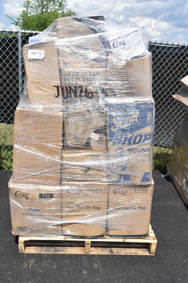 Package of 23 new scratch and dent items on pallet, including donut boxes, paper towel rolls, and take-out containers. Wrapped in plastic.