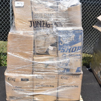 Package of 23 new scratch and dent items on pallet, including donut boxes, paper towel rolls, and take-out containers. Wrapped in plastic.