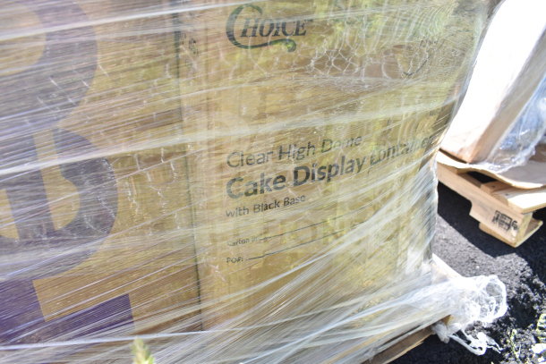 Plastic-wrapped pallet containing Choice brand clear high dome cake display container boxes with black bases. Scratch and dent items.