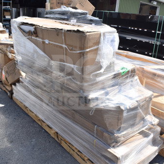 Pallet of 6 brand new items, scratch and dent, including a work table and air curtain, wrapped in plastic, outdoor warehouse setting.
