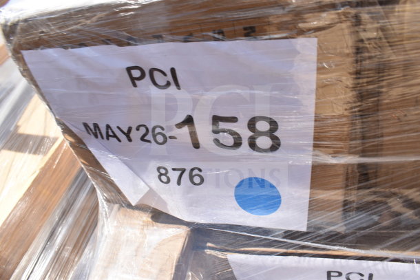 Plastic-wrapped box labeled "PCI MAY26-158 876," containing six new scratch and dent items, including a work table and air curtain.