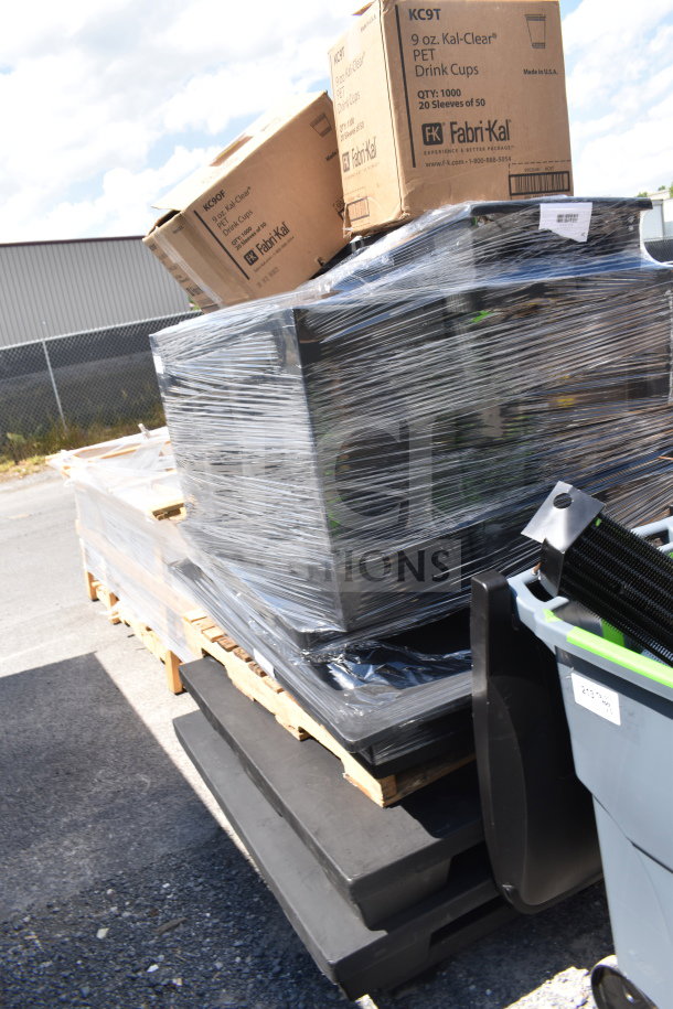Pallet with 12 new scratch and dent items, including display base and Fabri-Kal PET cups, wrapped in plastic for auction.