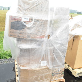 Pallet with 34 new scratch and dent items, including wine glasses, fast food trays, cutting board, and mop bucket, wrapped in plastic.