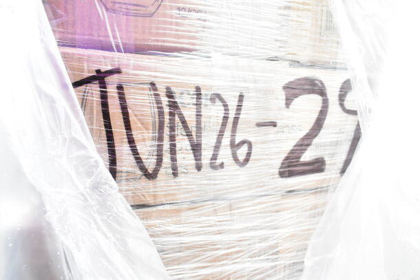 Wrapped pallet with "JUN26-29" marked; contains new assorted items like wine glasses, trays, and cups.