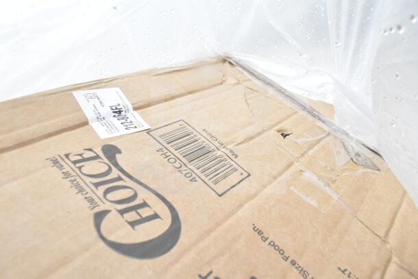 Cardboard box labeled "Choice" with visible barcode and text "Made in China." Box shows some wear, indicating contents are new scratch and dent items.