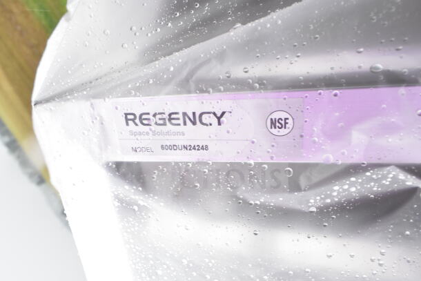 Regency Space Solutions dunnage rack, Model 600DUN24248, NSF certified, brand new, partial view through plastic covering.