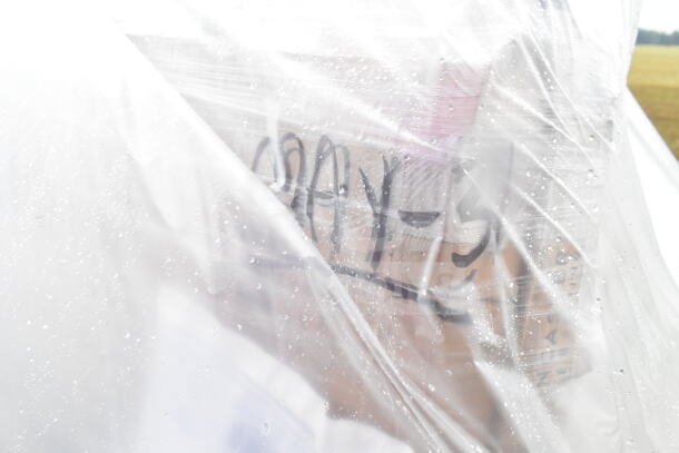 Plastic-wrapped package labeled "MAY-31," containing scratch and dent items like a food warmer, compressor, and thermostat.