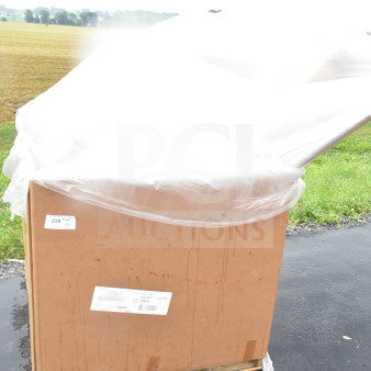 Large cardboard box covered with plastic wrap, labeled "220." Contains 12 new scratch and dent items including tray stand, plastic plates.