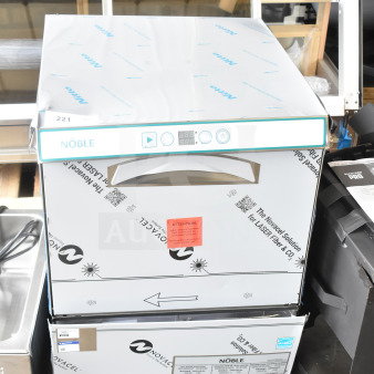 BRAND NEW Noble 495LTUC24 Commercial Low-Temp Undercounter Dishwasher, 120V, scratches and dents, protective wrap visible.