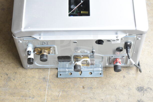 BRAND NEW Rinnai RX199iN tankless water heater, 199,000 BTU, wall-mounted, indoor/outdoor, labeled connections visible.
