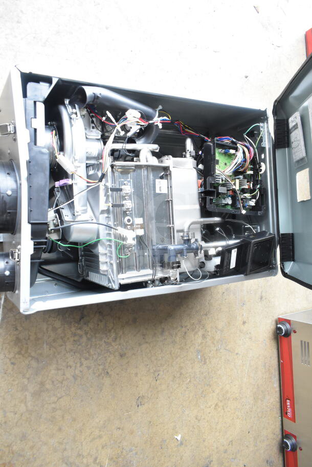 Brand new Rinnai SENSEI RX199iN tankless water heater, 199,000 BTU; interior view showing components and wiring.
