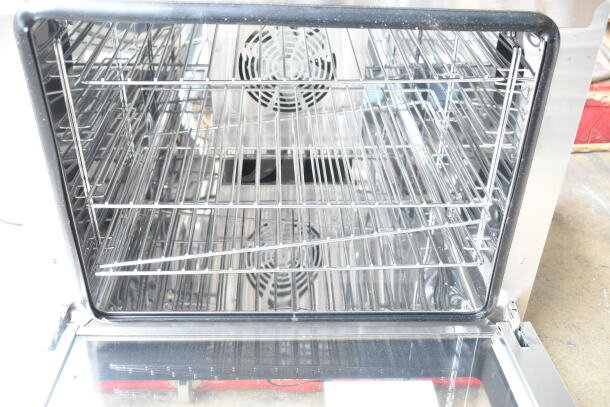 Brand new Avantco 177CO28M half-size countertop convection oven, 2.3 cu. ft., 208/240V, interior view with racks.