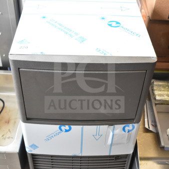 Manitowoc UDP0065A-161 NEO ice machine, 19 11/16", brand new, scratch and dent, with 31 lb. bin, 62 lb. capacity.