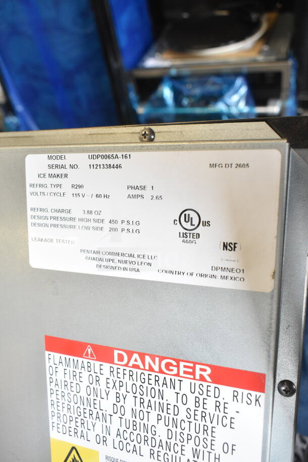 Brand new 2026 Manitowoc UDP0065A-161 ice machine with tags; 62 lb capacity, 115V, UL listed, made in Mexico.