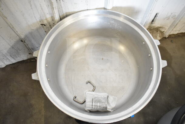 RiceMaster RM-55N-R gas rice cooker, 110-cup capacity, shown empty. Includes labels with cooking instructions.