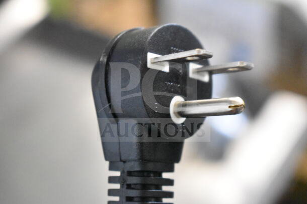 Close-up of a power cord plug for the Avantco RCB90 rice cooker, showing prongs and cord detail.