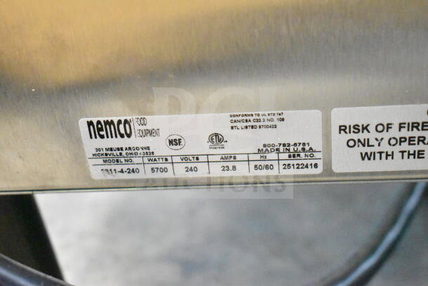 "BRAND NEW SCRATCH AND DENT! 2025 Nemco 6311-4-240 Electric Countertop Raised Hot Plate with 4 Solid Burners, label showing specs: 5700 watts, 240 volts, 23.8 amps, made in USA. ETL and NSF certified."