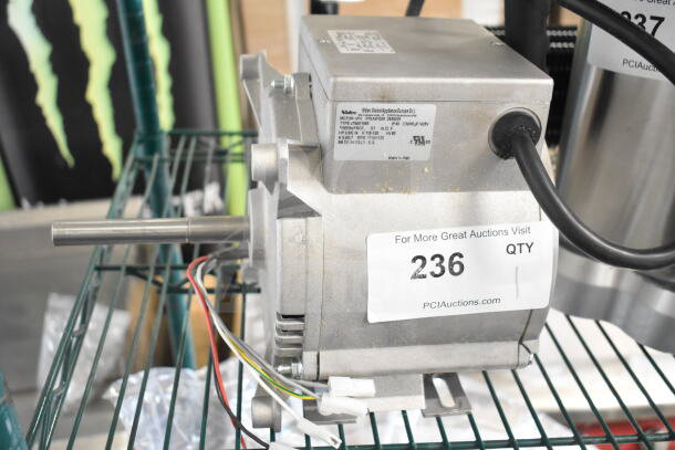 Brand new Nidec motor, 115-120V, 1 phase. Visible tags indicate slight scratches and dents. Made in Italy.