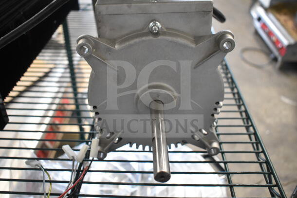 Brand new Nidec motor, 115-120V, 1 phase, scratch and dent condition, visible shaft, wiring connectors.
