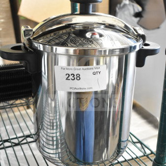 Brand new Monix 013206 stainless steel pressure cooker, 12.66 qt. capacity, minor scratches, tag indicates auction lot 238.