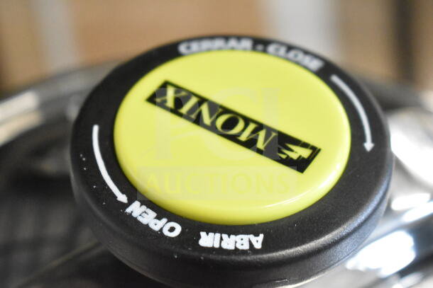 Monix 50 Cup Stainless Steel Pressure Cooker lid with black and yellow lever, marked "Open/Close". Brand new, scratch and dent.