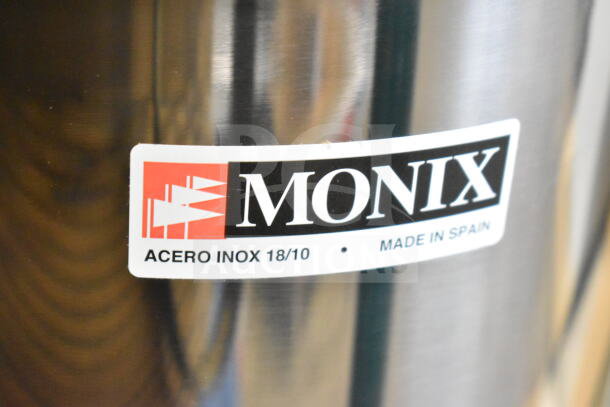 BRAND NEW Monix 50 Cup Stainless Steel Pressure Cooker. Scratch and dent. Label reads "ACERO INOX 18/10, Made in Spain."