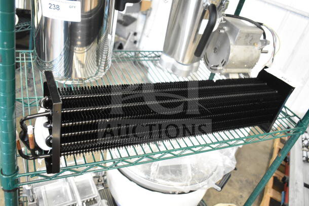 Brand new Monix evaporator coil 17818817, scratch and dent condition, black metal fins, visible copper tubing.