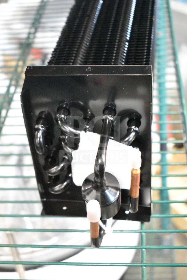 Monix evaporator coil, model 17818817, brand new with scratch and dent. Black tubing and connectors visible.