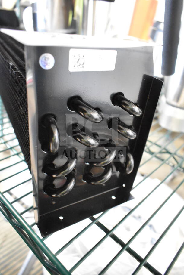 Brand new Monix 17818817 evaporator coil with minor scratches and dents, featuring black tubing and metal frame.