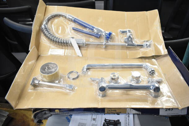 Brand new Waterloo Faucet with spray nozzle. Scratch and dent condition. Includes fittings and installation hardware.
