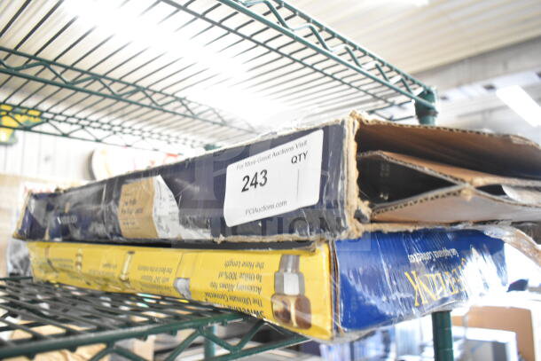 Brand new Waterloo Faucet with Spray Nozzle in open, scratched box. Auction label “243” visible.