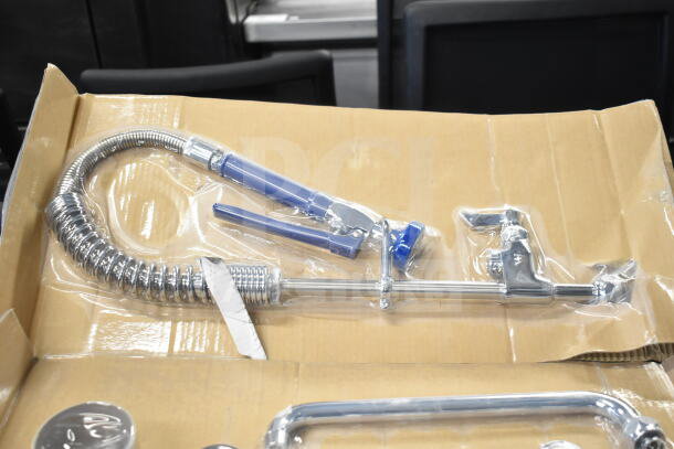 Brand new Waterloo faucet with spray nozzle, scratch and dent condition, chrome finish, boxed packaging.