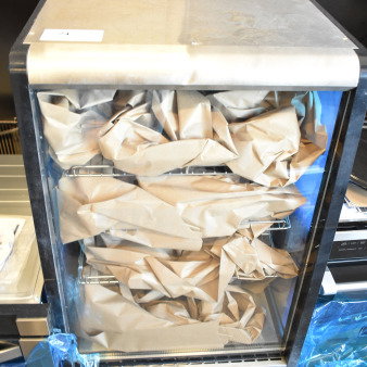 Brand new KoolMore CDC-49-SS 4-tier commercial bakery display refrigerator, 24 inches, 110-120V, scratch and dent condition.