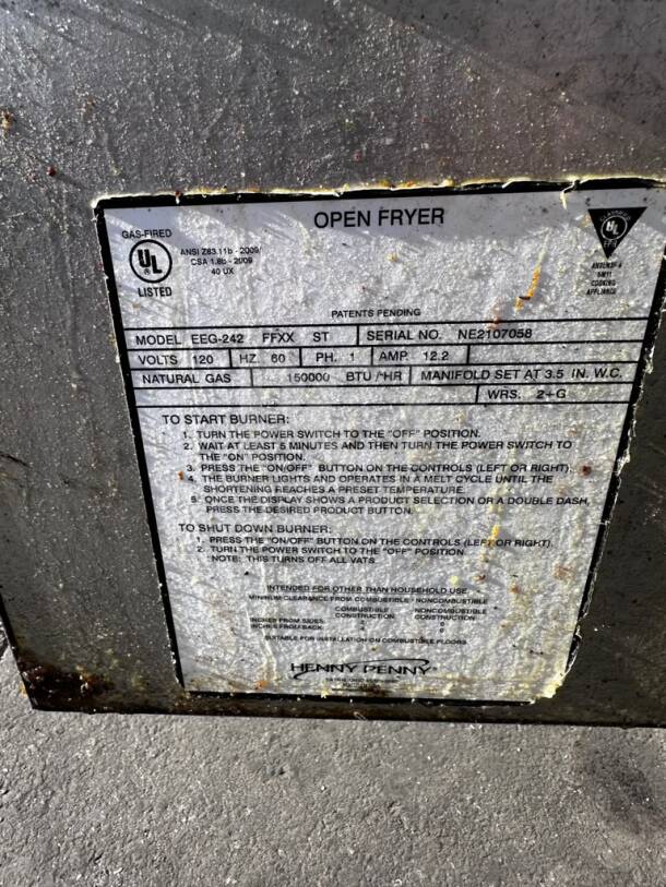 Henny Penny EEG242.0_NAT label showing model, serial number NE2107058, and gas specifications for fryer.