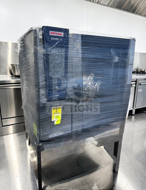 Rational iCombi Pro LM100EG.AX 6-pan combi oven, top-tier condition, natural gas, 208/240V, with caution label visible.