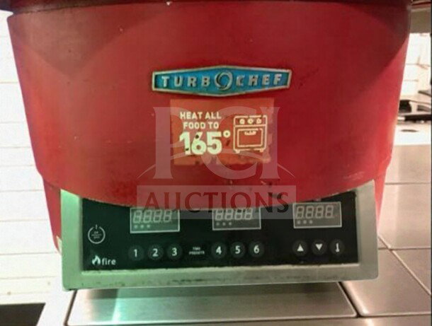 Red TurboChef FIRE countertop pizza oven, model TURBO-L-FIRE-0500, operational with digital controls.