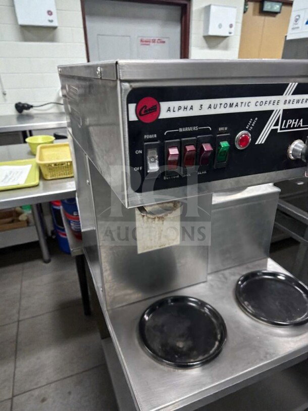 Wilbur Curtis Alpha 3 coffee brewer in like-new condition, 120V, UL & NSF listed. Features knobs, labels, and dual warmers.
