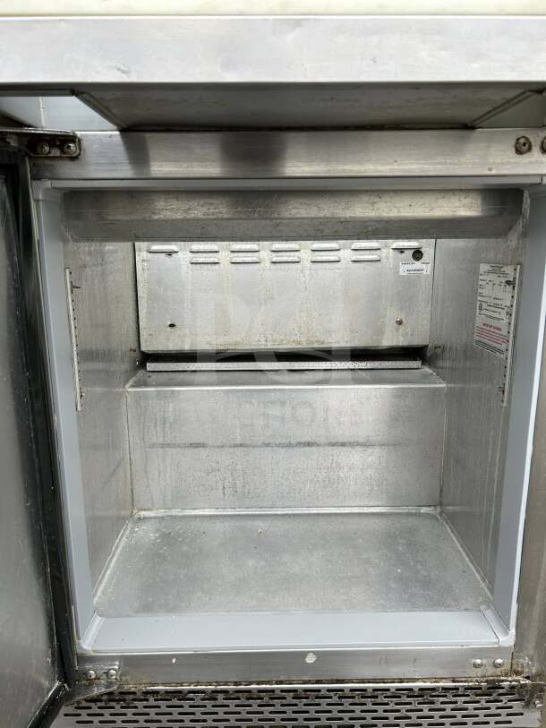 Continental SW27-12M sandwich prep unit, 27" wide, 7.4 cu. ft., UL & NSF listed, interior view, excellent condition.