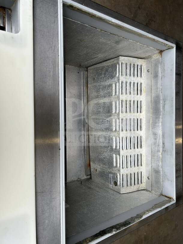 Continental SW27-12M Mighty Top refrigerated prep unit in excellent condition; interior view showing clean metal surface.
