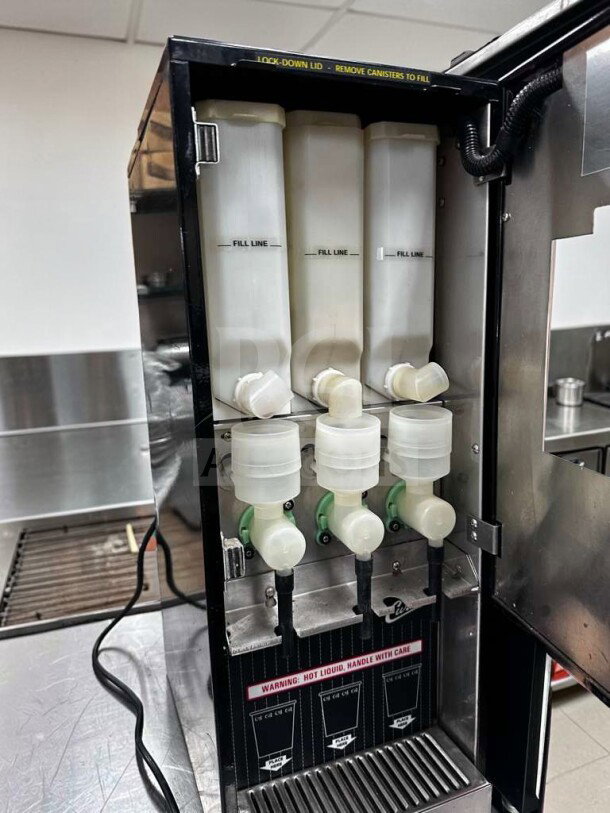 Outstanding condition Wilbur Curtis Cafe Series Primo PC-3D-10-01 cappuccino machine with 3 hoppers; 120V; fully tested.