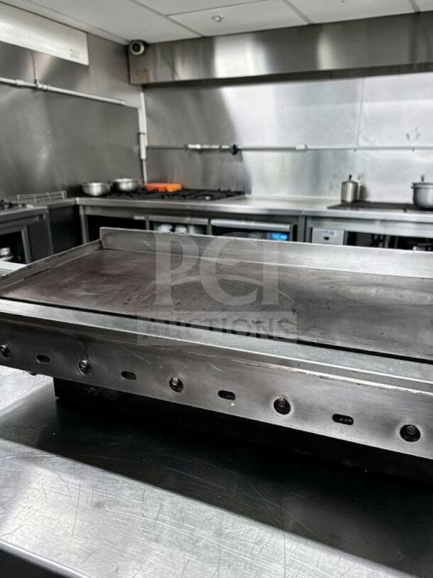 Jade Range 60" thermostatic gas griddle in excellent condition, heavy-duty commercial flat top, natural gas, fully operational.