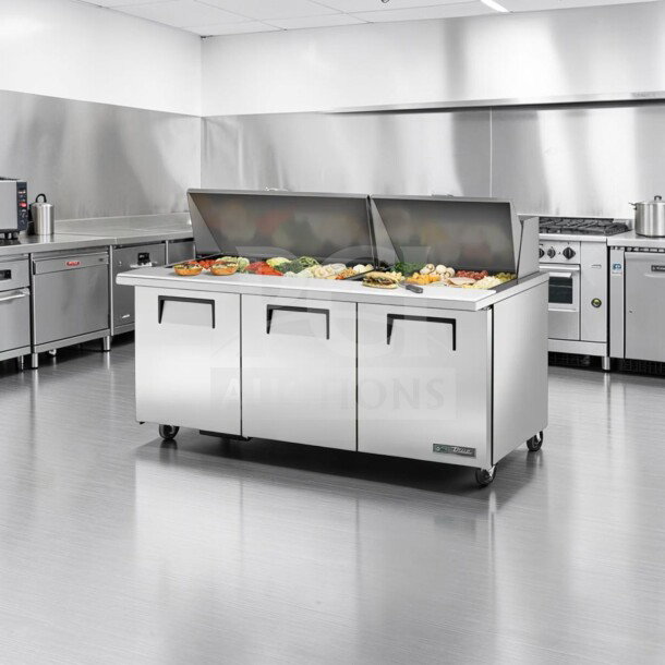 True TSSU-72-30M-B-ST-HC 72” mega top sandwich/salad prep table, elite condition, refrigerated base, 115V, fully tested.
