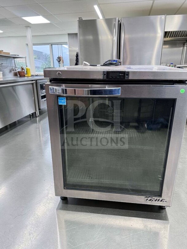 True TUC-27G-HC undercounter refrigerator with glass door in stainless steel. Superior condition, 27", 115V, fully tested.
