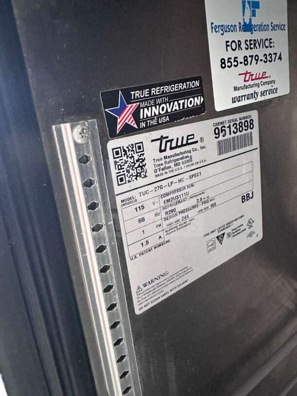 Label details on True TUC-27G-HC, stainless steel undercounter refrigerator, showing model, serial number 9613898, and specs.