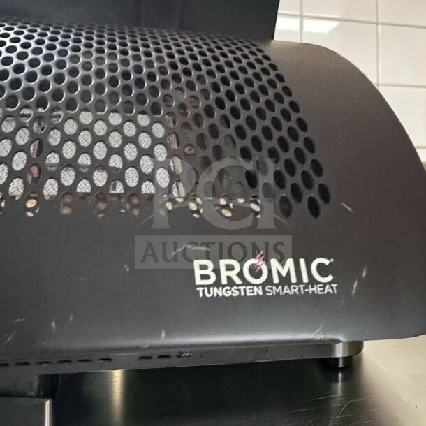 Bromic Tungsten Smart-Heat gas patio heater, wall-mounted, elite condition, fully operational, visible logo on vented casing.
